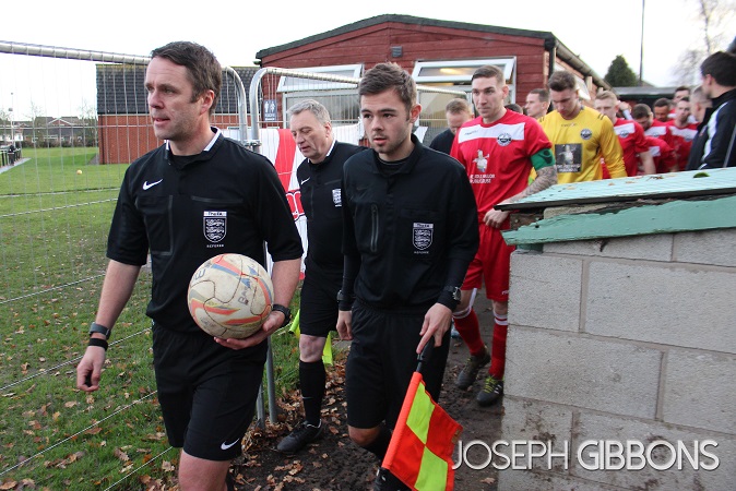 Father and son lead the sides out
