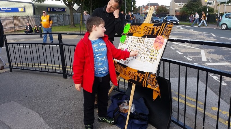 Man falls asleep while child chooses a badge